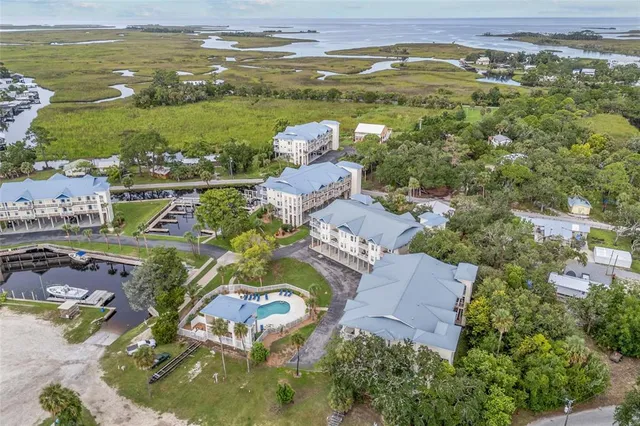 an aerial view of residential houses with outdoor space