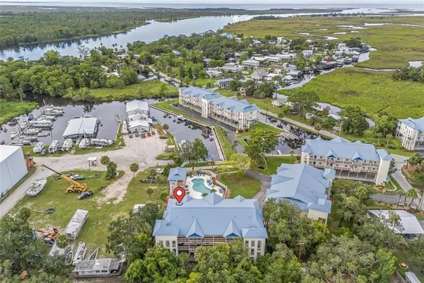 an aerial view of residential houses with outdoor space