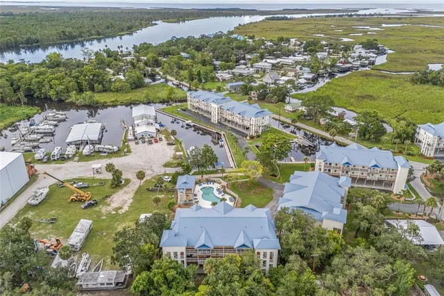 an aerial view of a house with a lake view