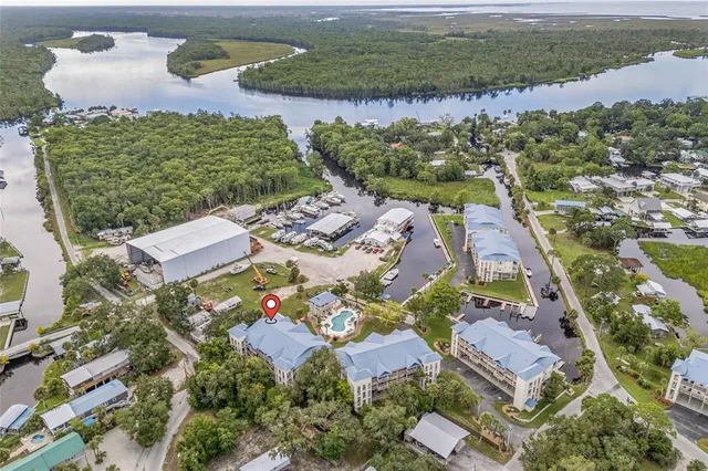 an aerial view of a house with a lake view
