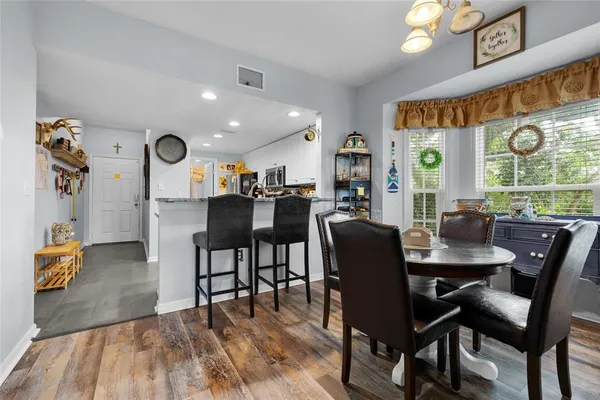 a view of a dining room with furniture and window