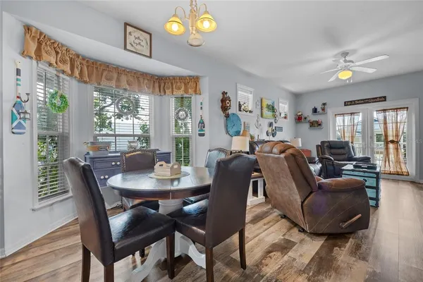 a view of a dining room with furniture window and outside view