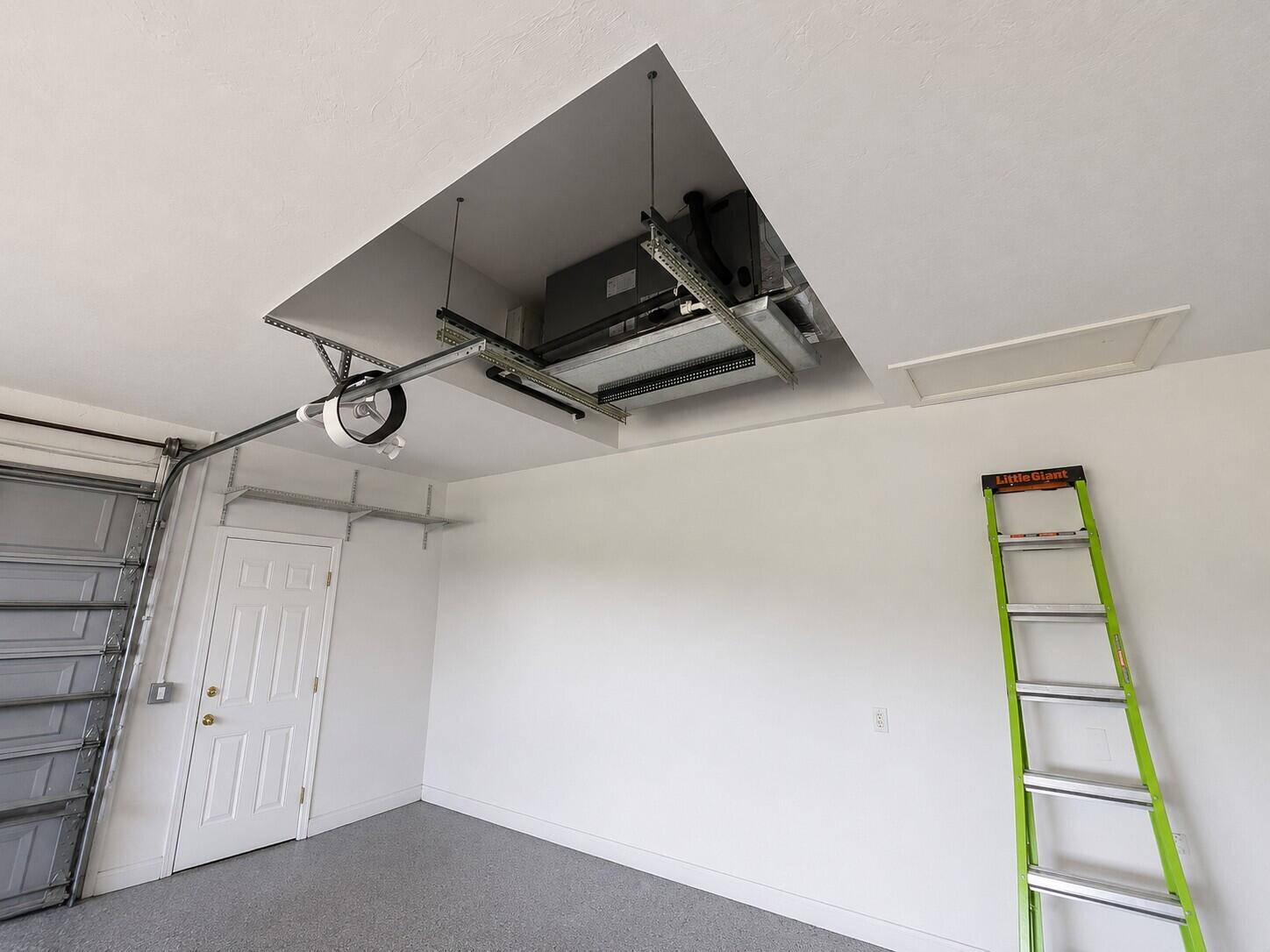 2049 San Marco Road Marco Island, FL 34145 - Photo 70 of 71 AC Unit in Garage with AI Editing