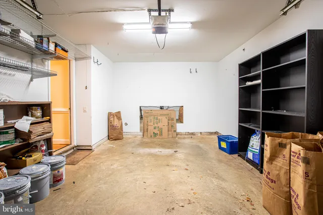 a bed room with a bed and a television