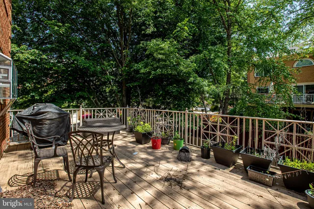 a view of a chairs and table in the patio