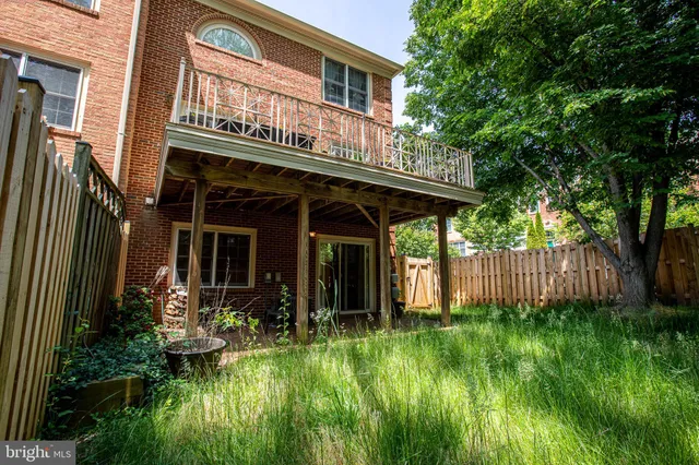 a view of a house with pool and garden