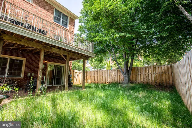a view of a house with a yard and plants