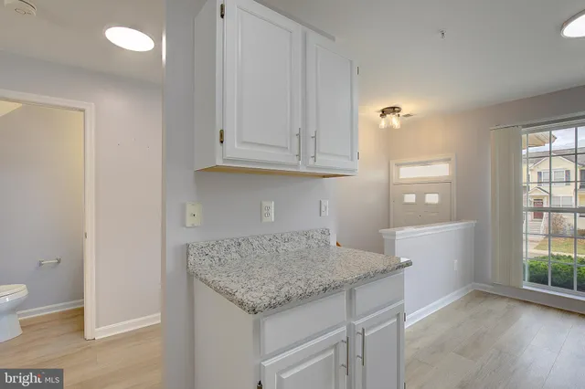 wooden floor in an empty room and a window