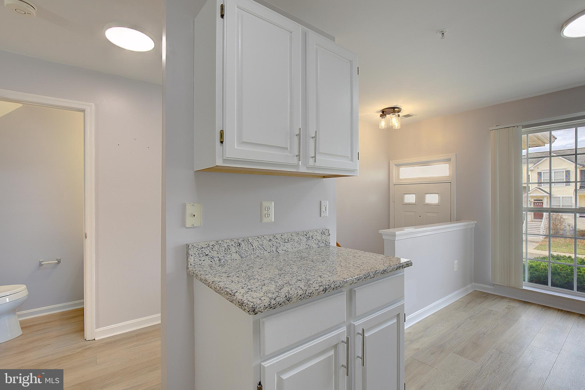 1700 Fallowfield Court Crofton, MD 21114 - Photo 11 of 34 wooden floor in an empty room and a window
