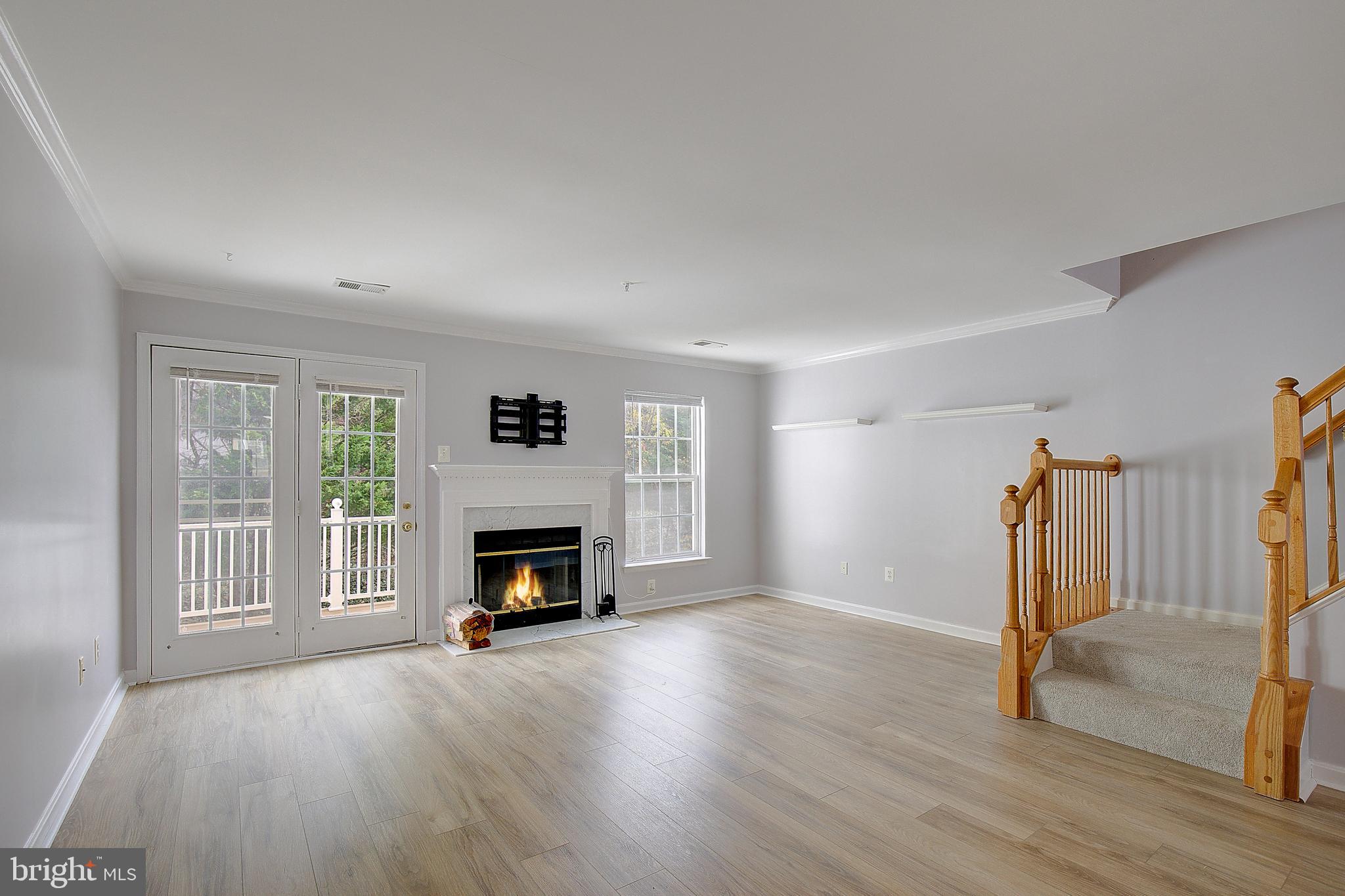 1700 Fallowfield Court Crofton, MD 21114 - Photo 16 of 34 wooden floor fireplace and natural light in room