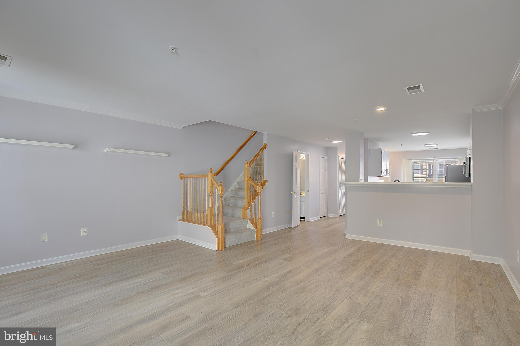 1700 Fallowfield Court Crofton, MD 21114 - Photo 18 of 34 an empty room with wooden floor and windows