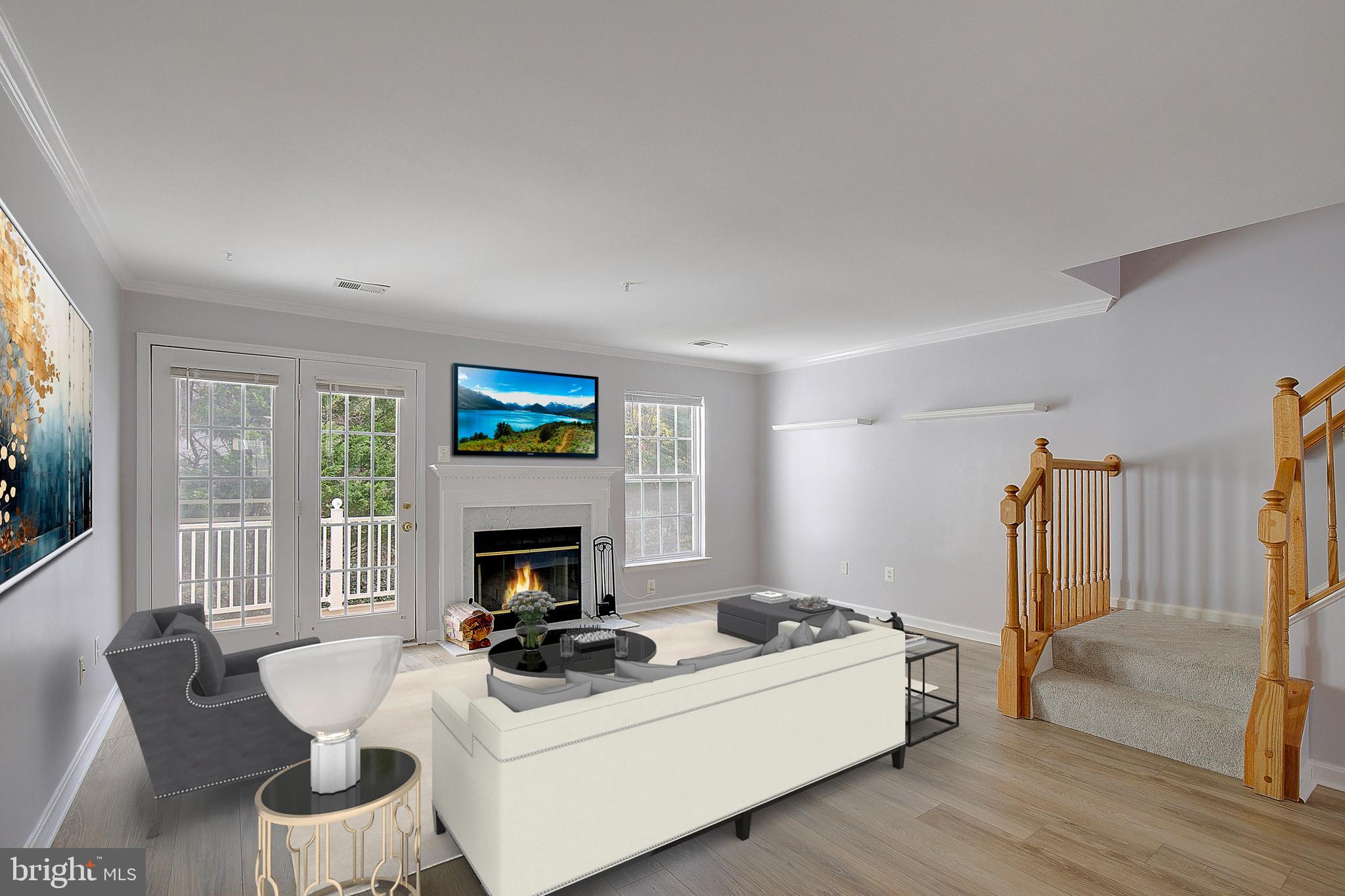 1700 Fallowfield Court Crofton, MD 21114 - Photo 20 of 34 a living room with furniture a fireplace and a flat screen tv