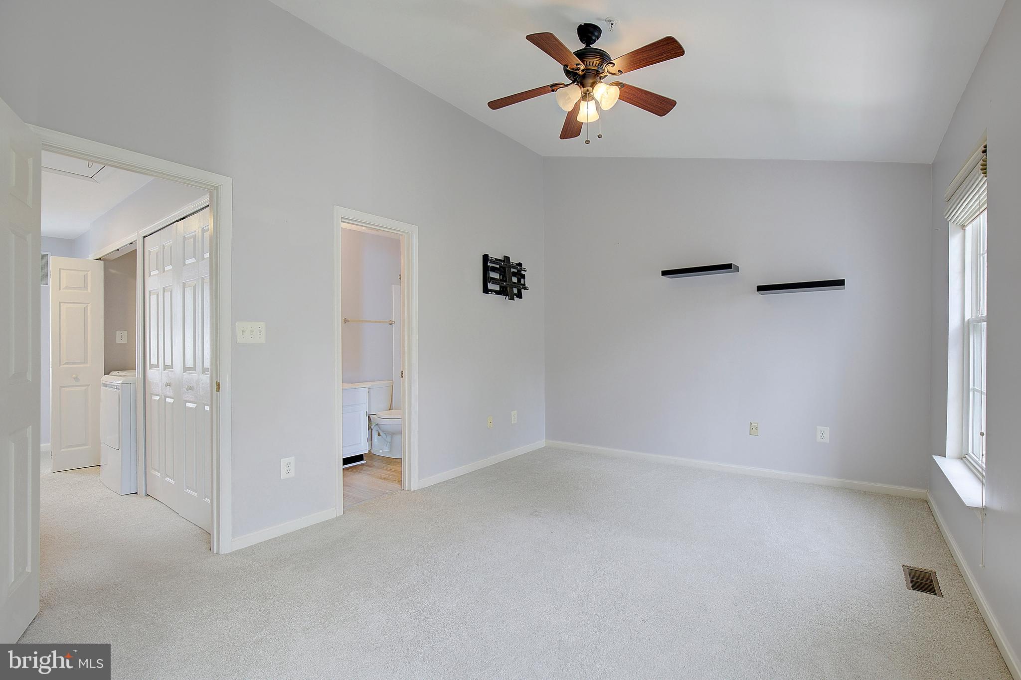 1700 Fallowfield Court Crofton, MD 21114 - Photo 26 of 34 wooden floor in an empty room with a window