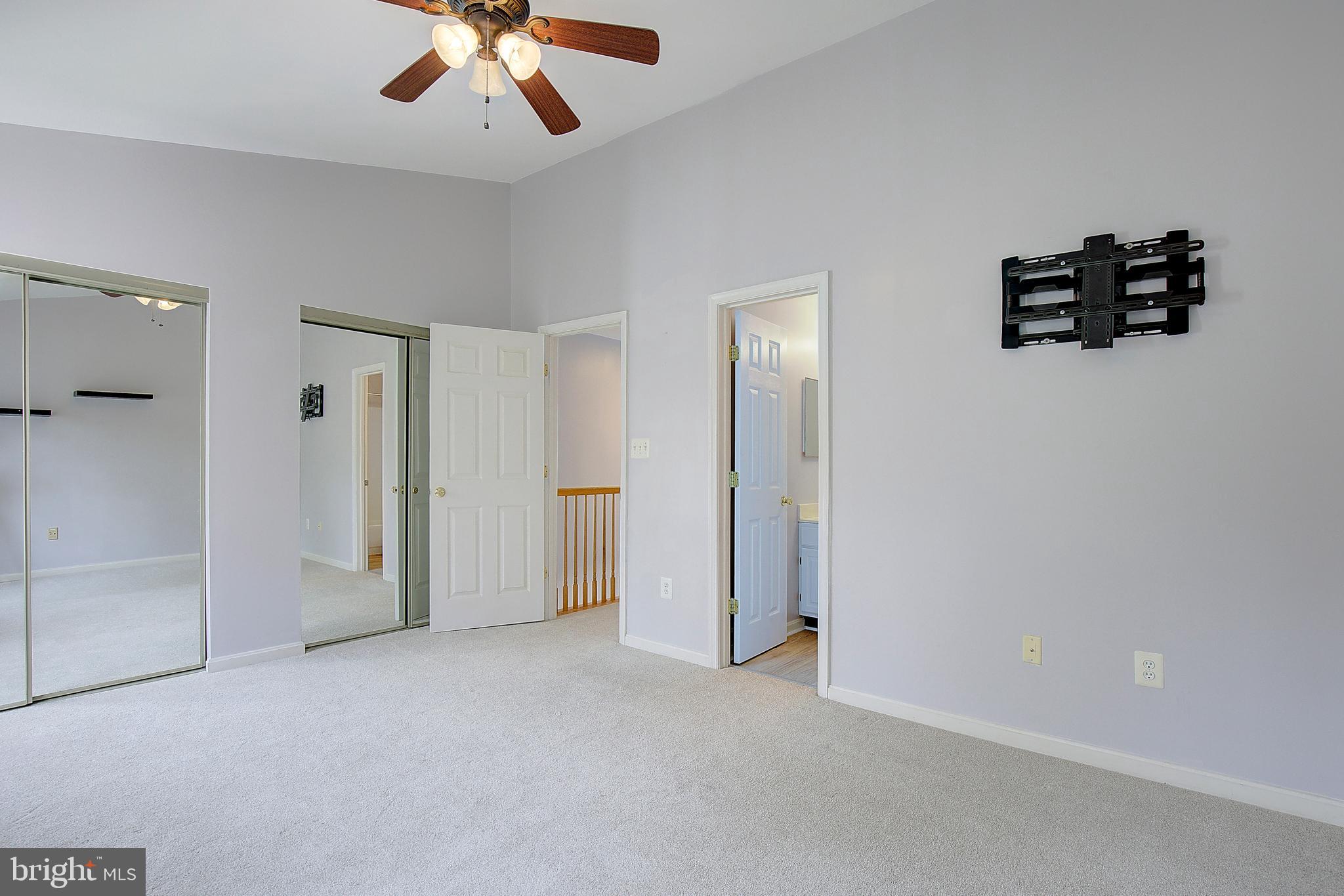1700 Fallowfield Court Crofton, MD 21114 - Photo 27 of 34 an empty room with windows and ceiling fan
