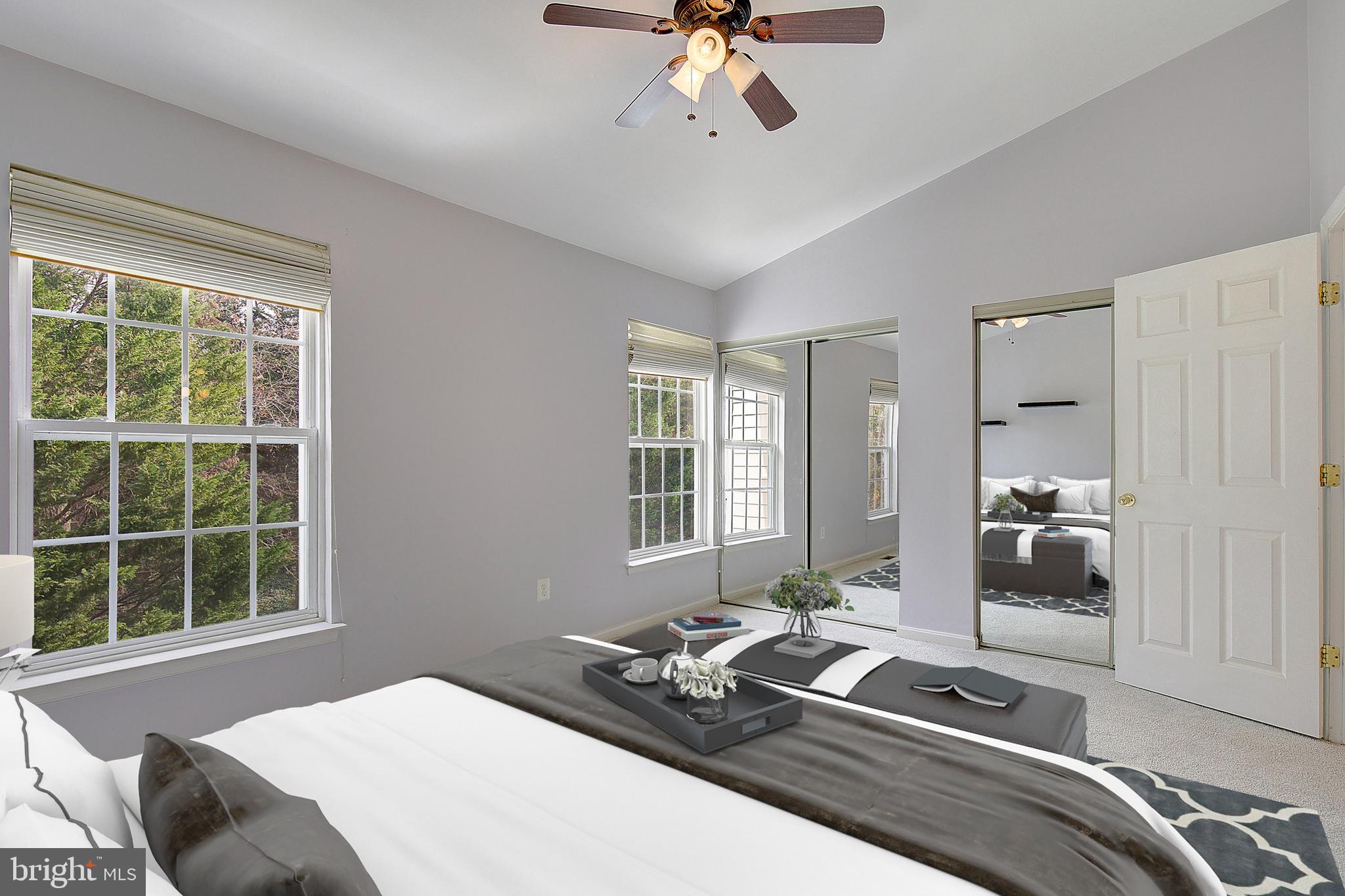 1700 Fallowfield Court Crofton, MD 21114 - Photo 28 of 34 a bedroom with a bed and wooden floor