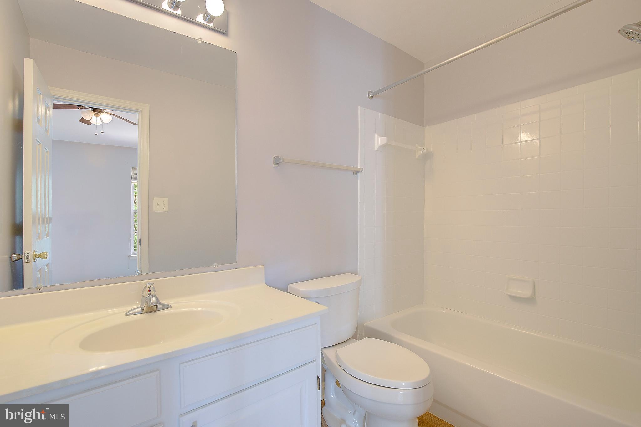 1700 Fallowfield Court Crofton, MD 21114 - Photo 33 of 34 a bathroom with a sink a toilet and a bathtub