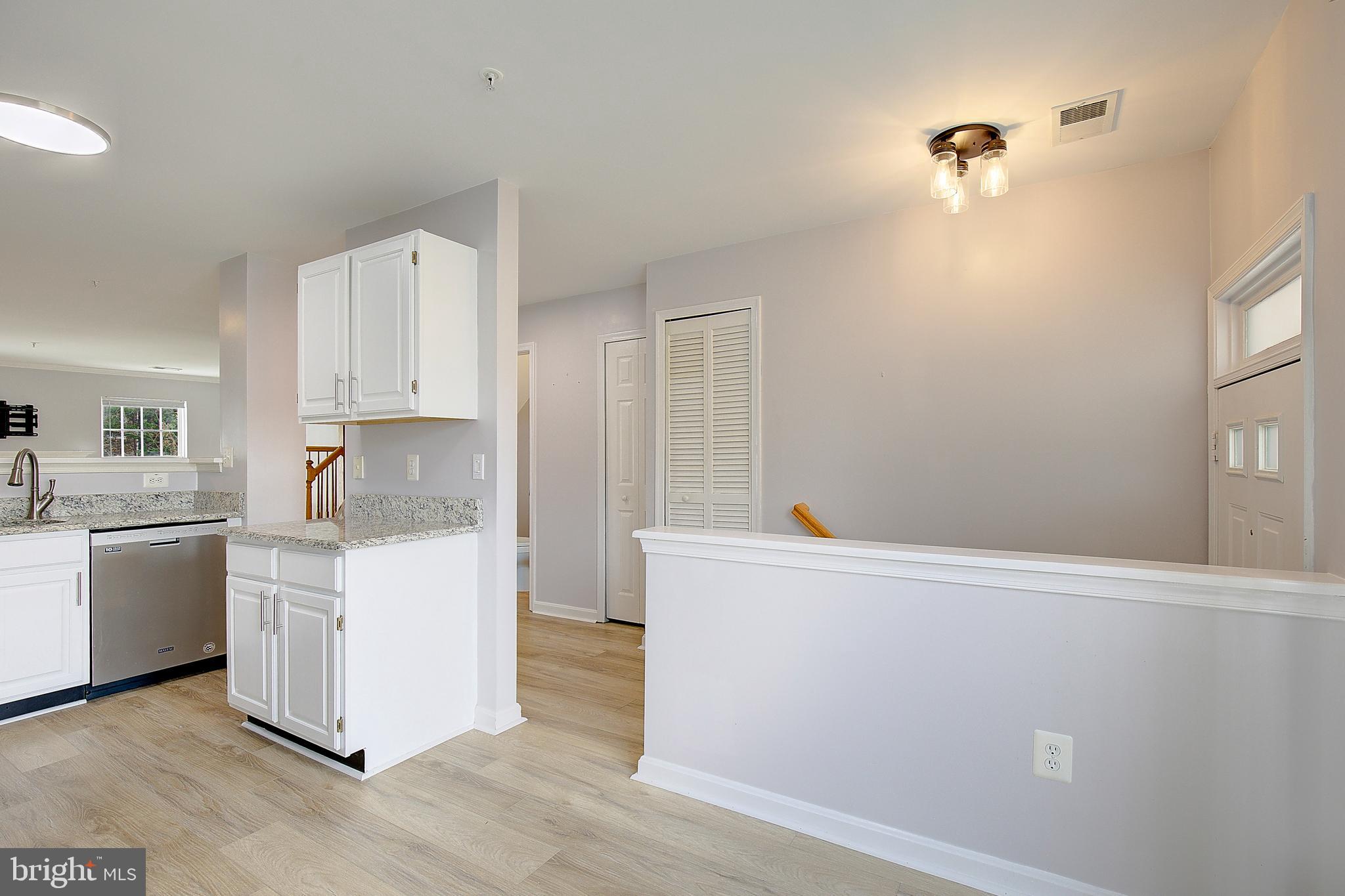 1700 Fallowfield Court Crofton, MD 21114 - Photo 7 of 34 a kitchen with a cabinets and wooden floor