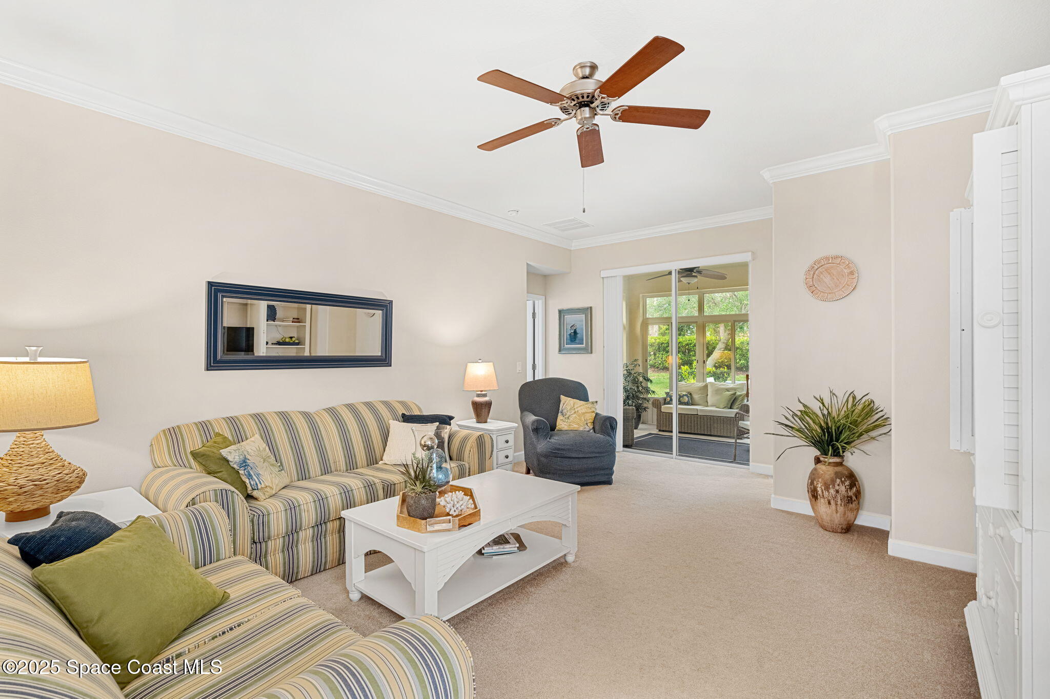 6741 Ringold Street Melbourne, FL 32940 - Photo 12 of 45 a living room with furniture and a large window