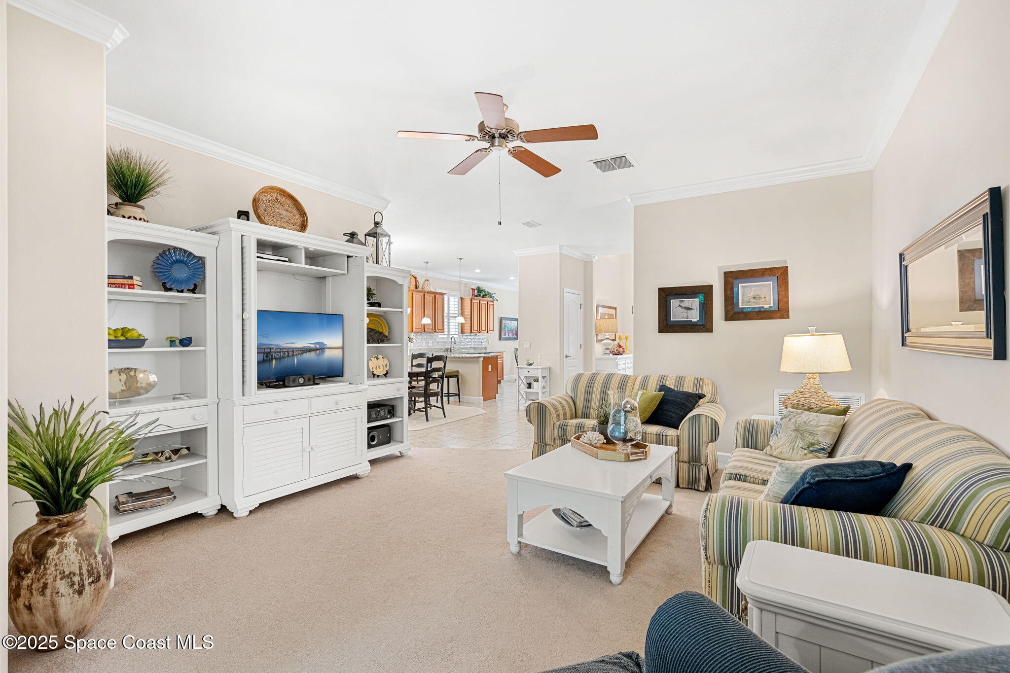 6741 Ringold Street Melbourne, FL 32940 - Photo 14 of 45 a living room with furniture and a flat screen tv