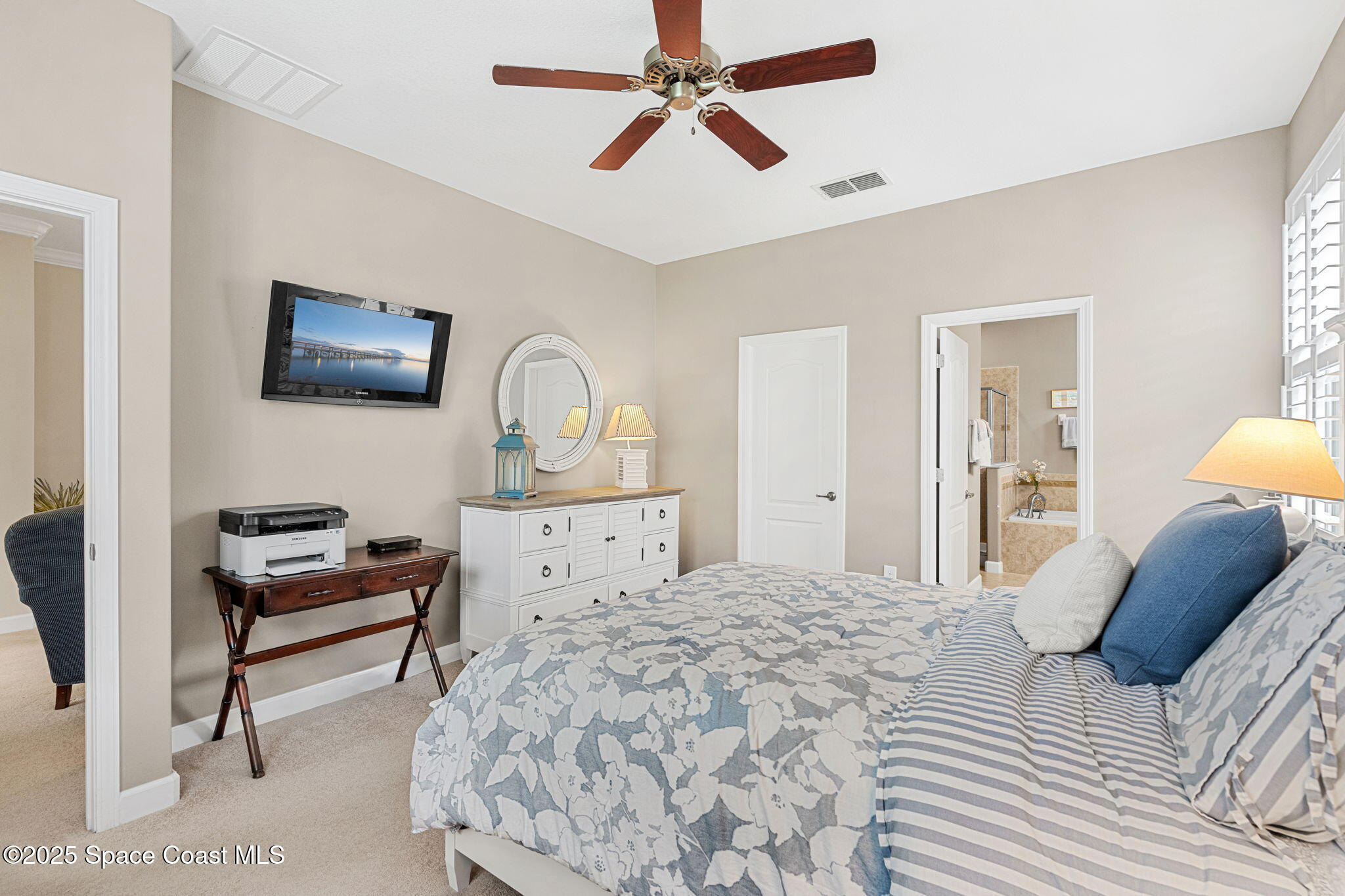 6741 Ringold Street Melbourne, FL 32940 - Photo 16 of 45 a bedroom with a bed and a couch