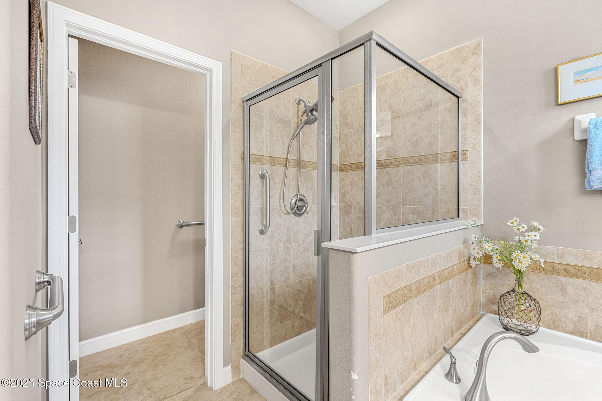 6741 Ringold Street Melbourne, FL 32940 - Photo 18 of 45 a bathroom with a granite countertop shower a sink and a mirror