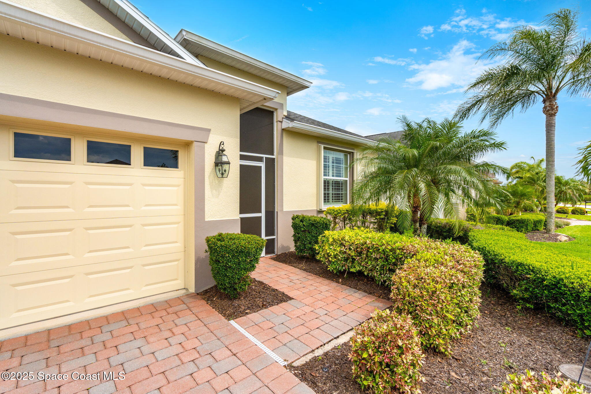 6741 Ringold Street Melbourne, FL 32940 - Photo 2 of 45 a front view of a house with garden
