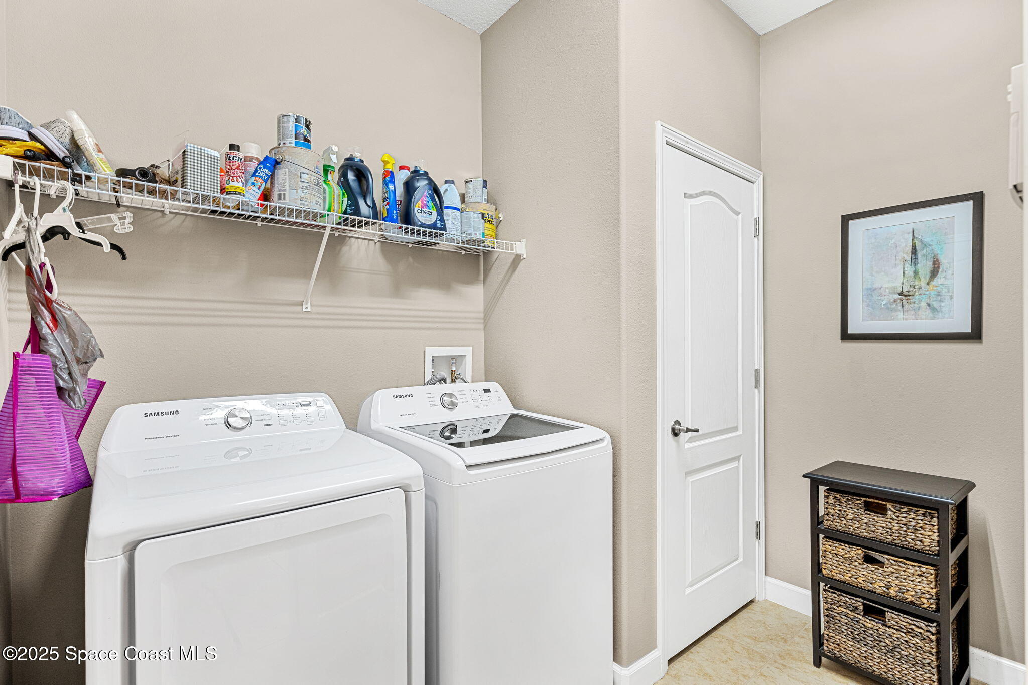 6741 Ringold Street Melbourne, FL 32940 - Photo 22 of 45 a utility room with dryer and washer