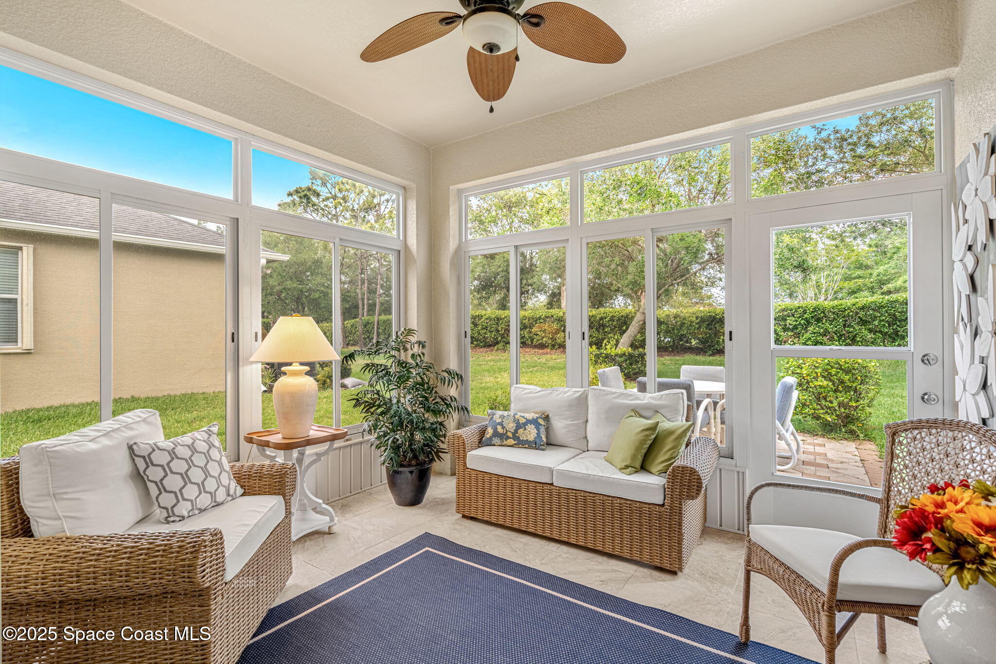 6741 Ringold Street Melbourne, FL 32940 - Photo 24 of 45 Enclosed lanai w/ tropical landscaping