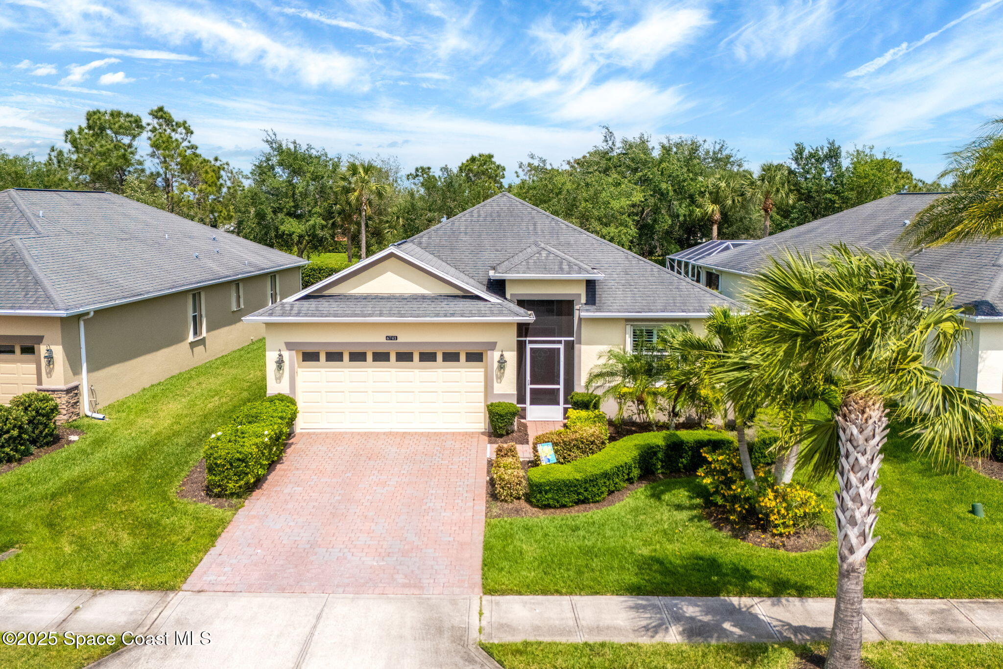 6741 Ringold Street Melbourne, FL 32940 - Photo 29 of 45 a house with green field in front of it