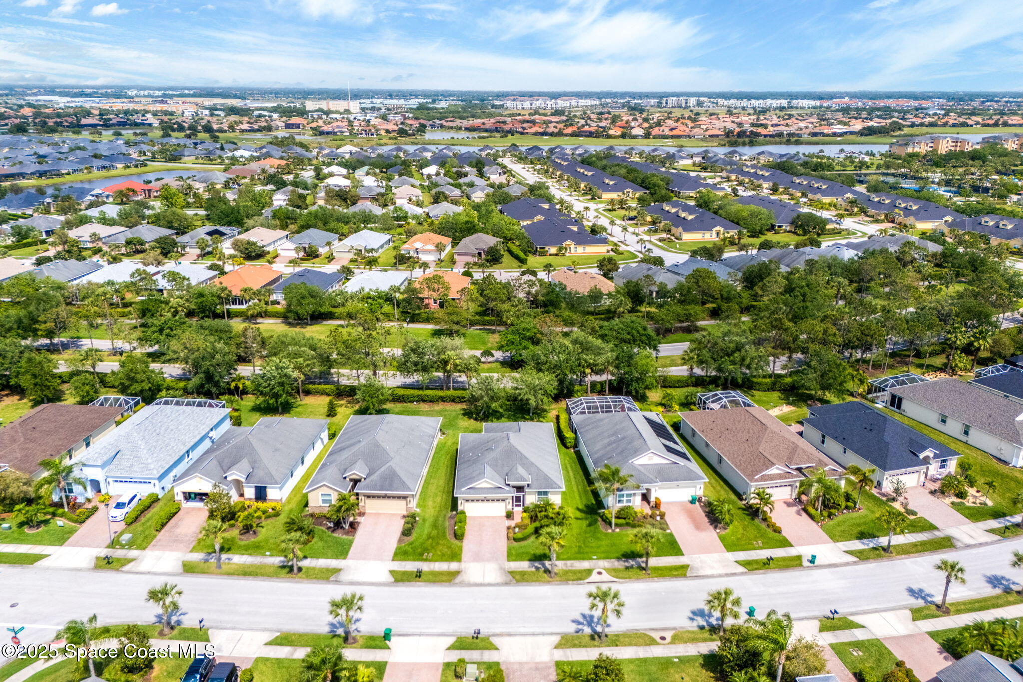 6741 Ringold Street Melbourne, FL 32940 - Photo 32 of 45 an aerial view of residential houses with outdoor space