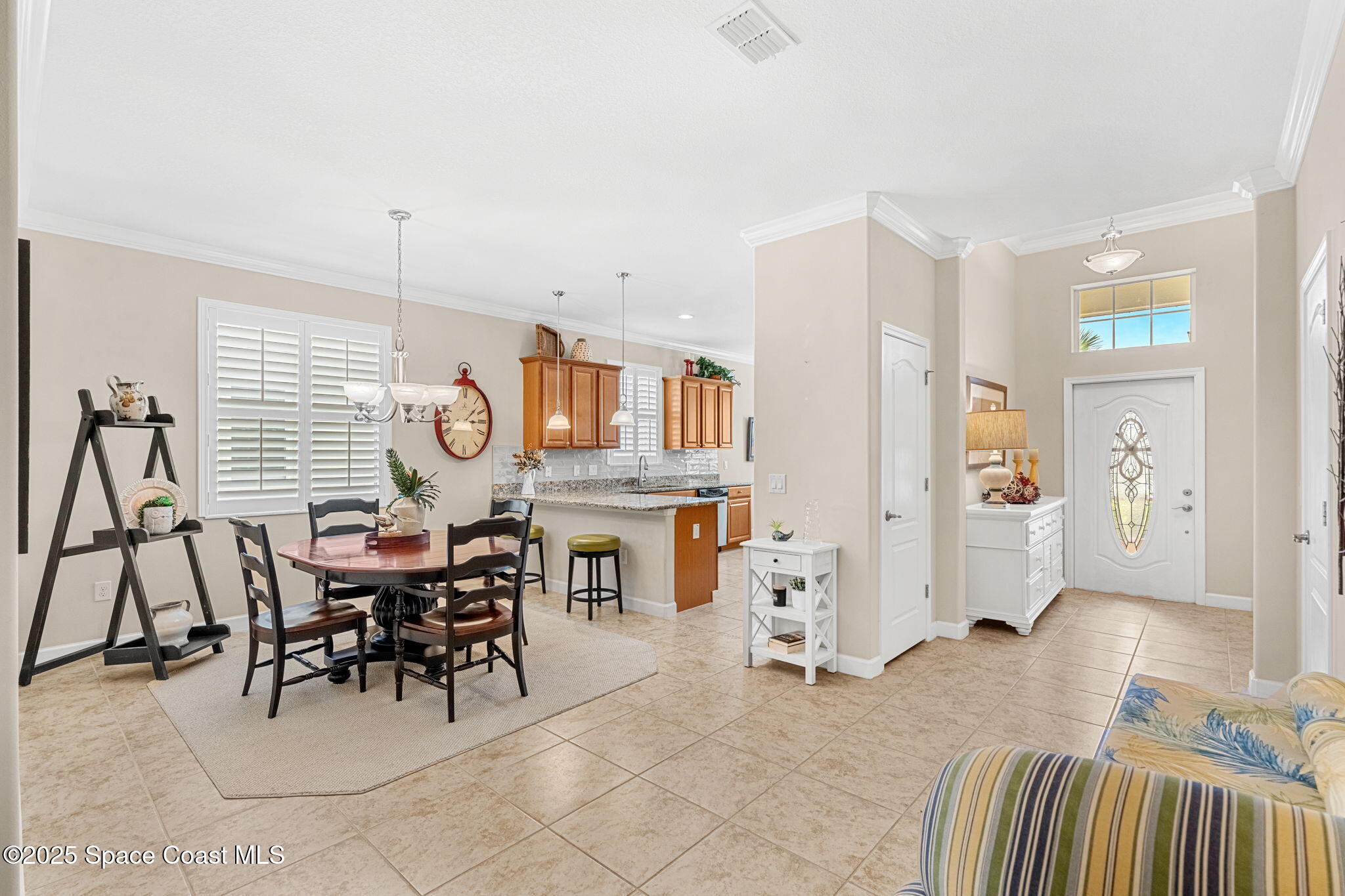 6741 Ringold Street Melbourne, FL 32940 - Photo 5 of 45 a view of a livingroom with furniture and dining area