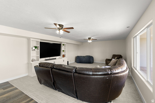 2591 East Washington Dam Road Washington, UT 84780 - Photo 38 of 67 Entertainment space featuring built-in media cabinetry, recessed lighting, and ceiling fans