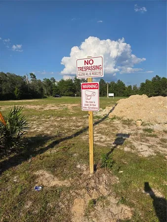 a sign board on the side of a road
