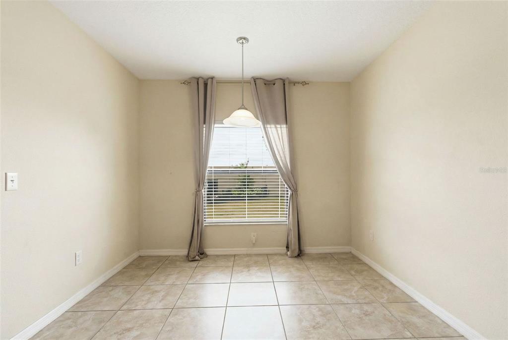 10135 Newminster Loop Ruskin, FL 33573 - Photo 15 of 35 a view of an empty room with a window