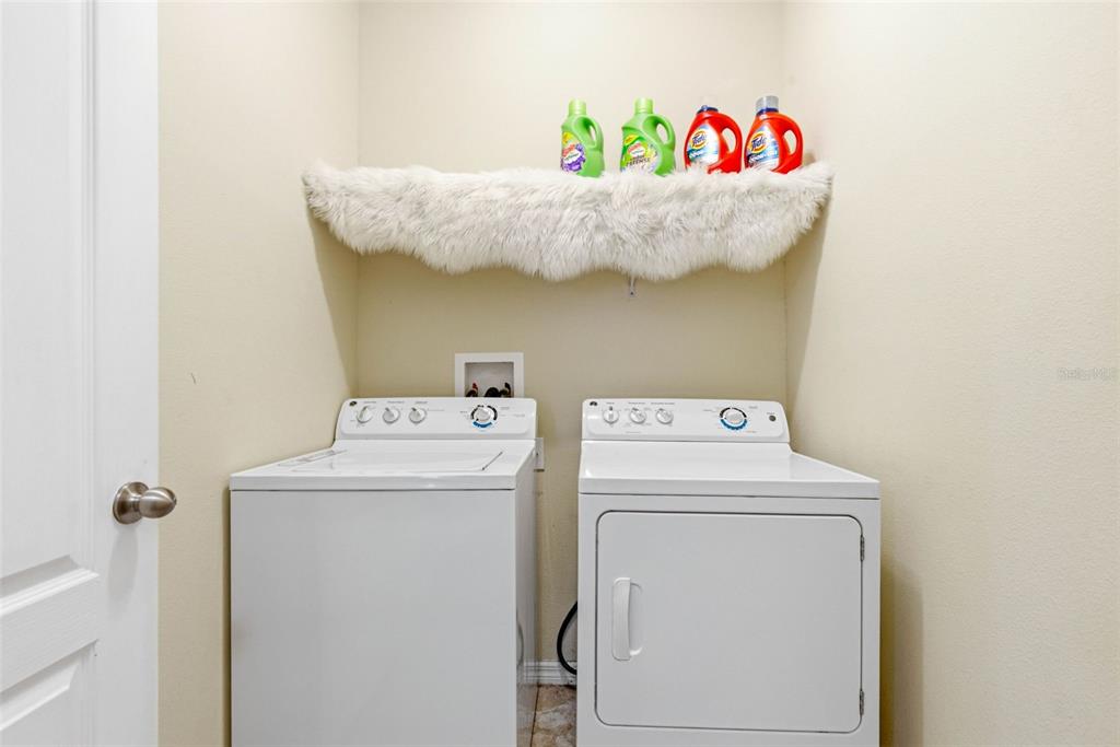 10135 Newminster Loop Ruskin, FL 33573 - Photo 17 of 35 a utility room with dryer and washer