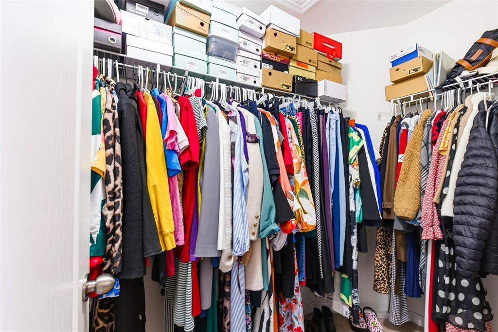 10135 Newminster Loop Ruskin, FL 33573 - Photo 23 of 35 a view of walk in closet with clothes
