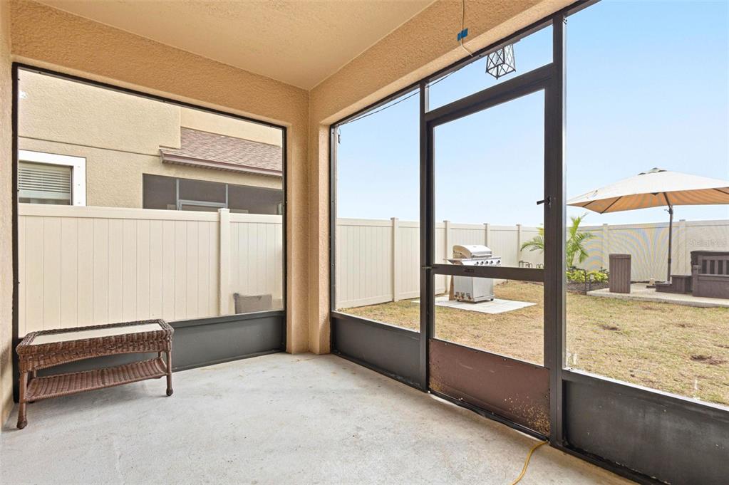 10135 Newminster Loop Ruskin, FL 33573 - Photo 31 of 35 a living room with a large window