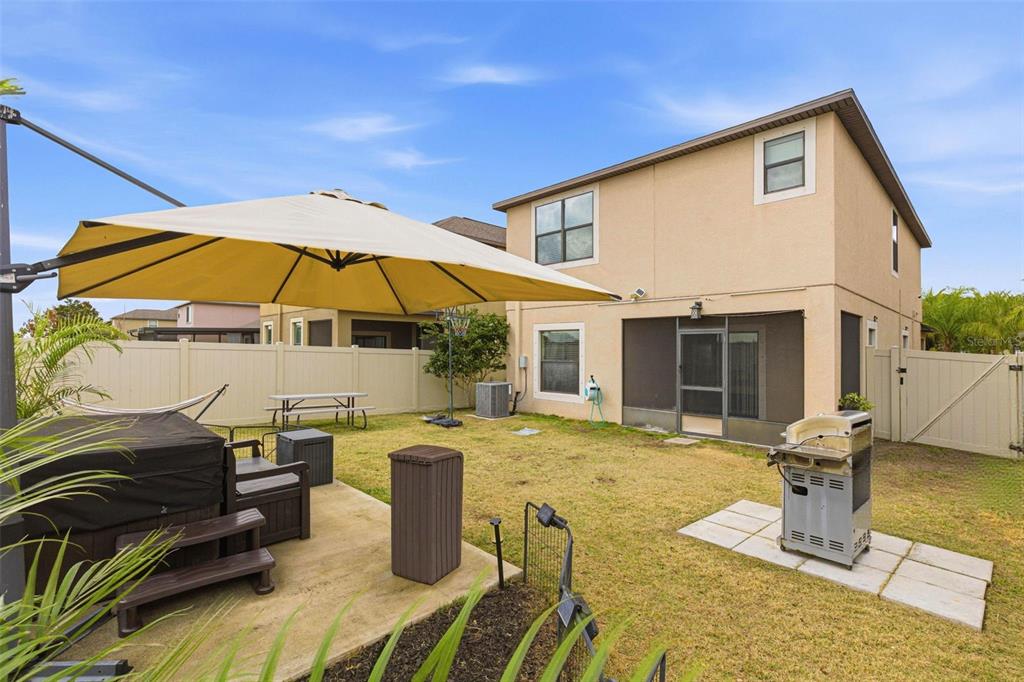 10135 Newminster Loop Ruskin, FL 33573 - Photo 33 of 35 a view of a house with backyard outdoor seating area and furniture