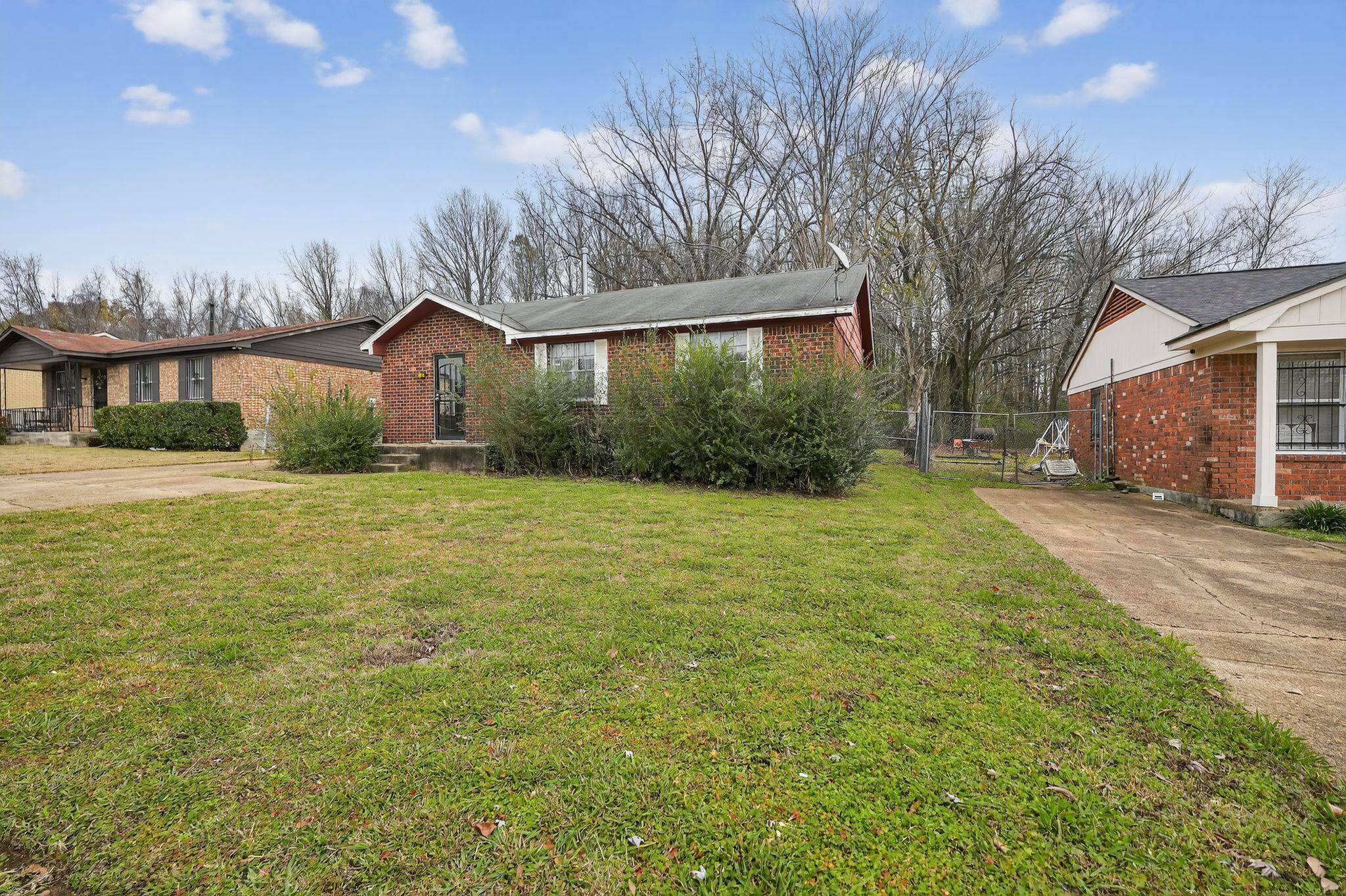 3420 Forrester Road Memphis, TN 38109 - Photo 2 of 30 View of front facade with brick siding and concrete driveway