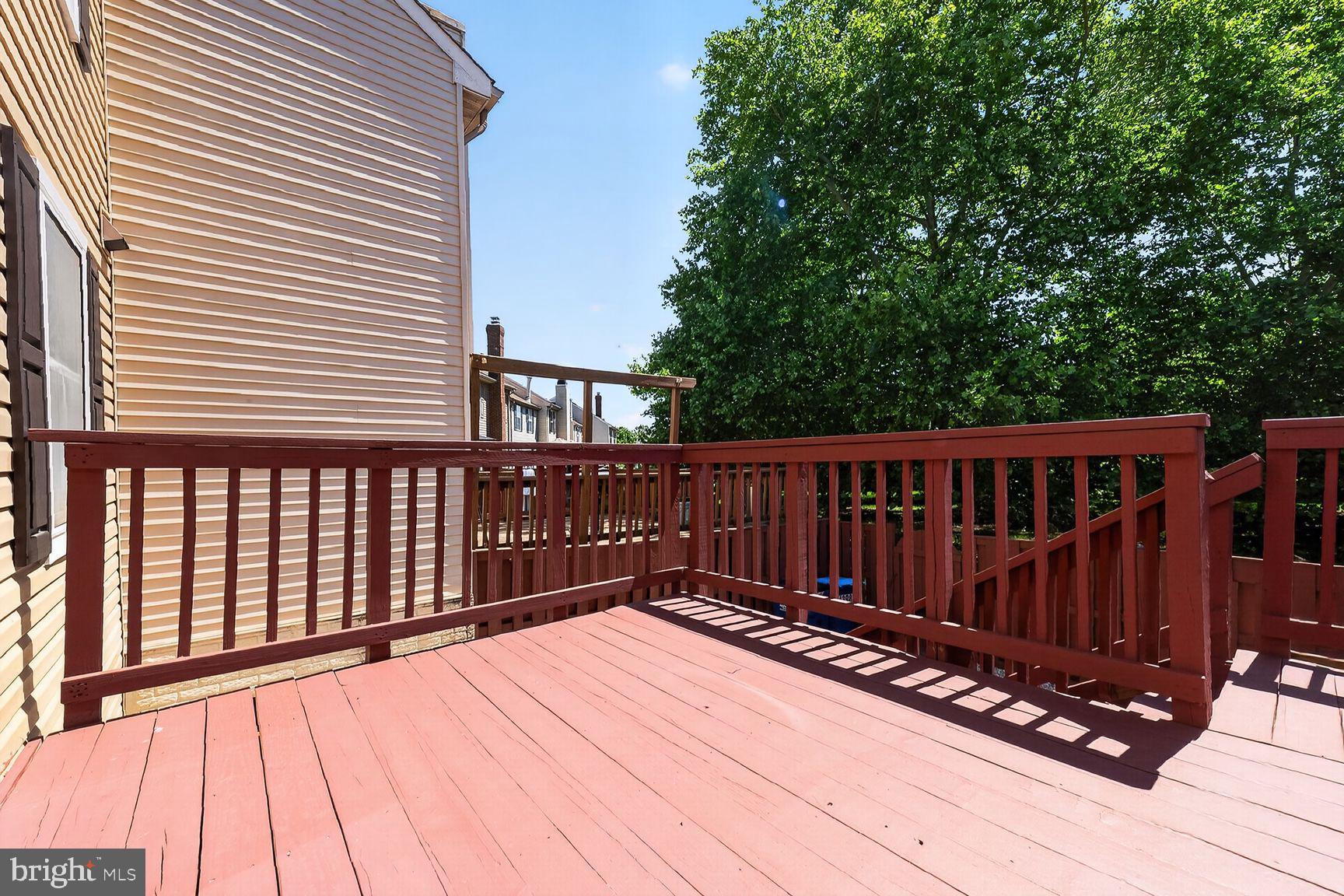 43983 Choptank Terrace Ashburn, VA 20147 - Photo 20 of 21 Sunny deck with lush green backdrop.