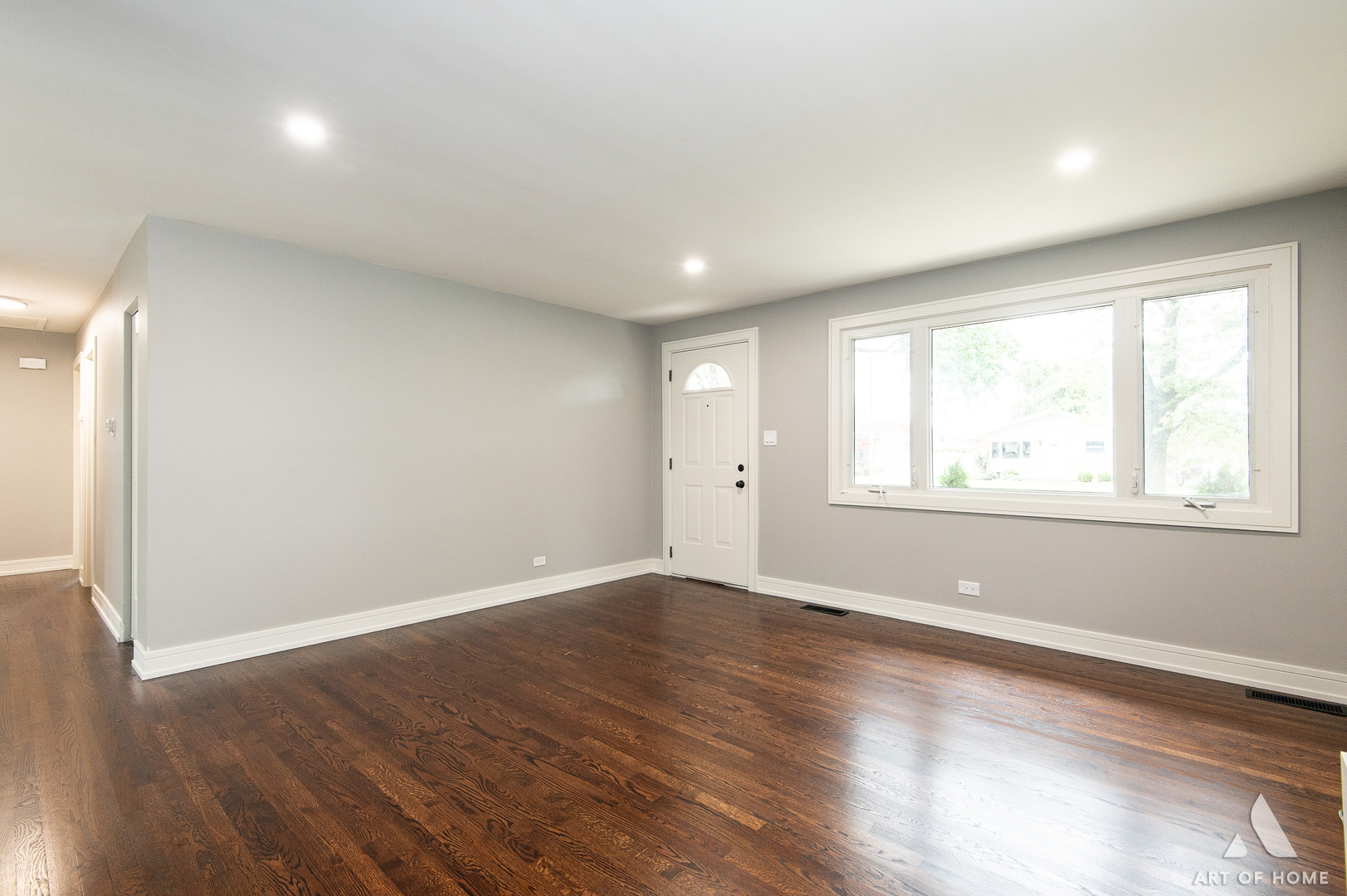 9128 Homestead Lane Bridgeview, IL 60455 - Photo 11 of 32 an empty room with wooden floor and windows