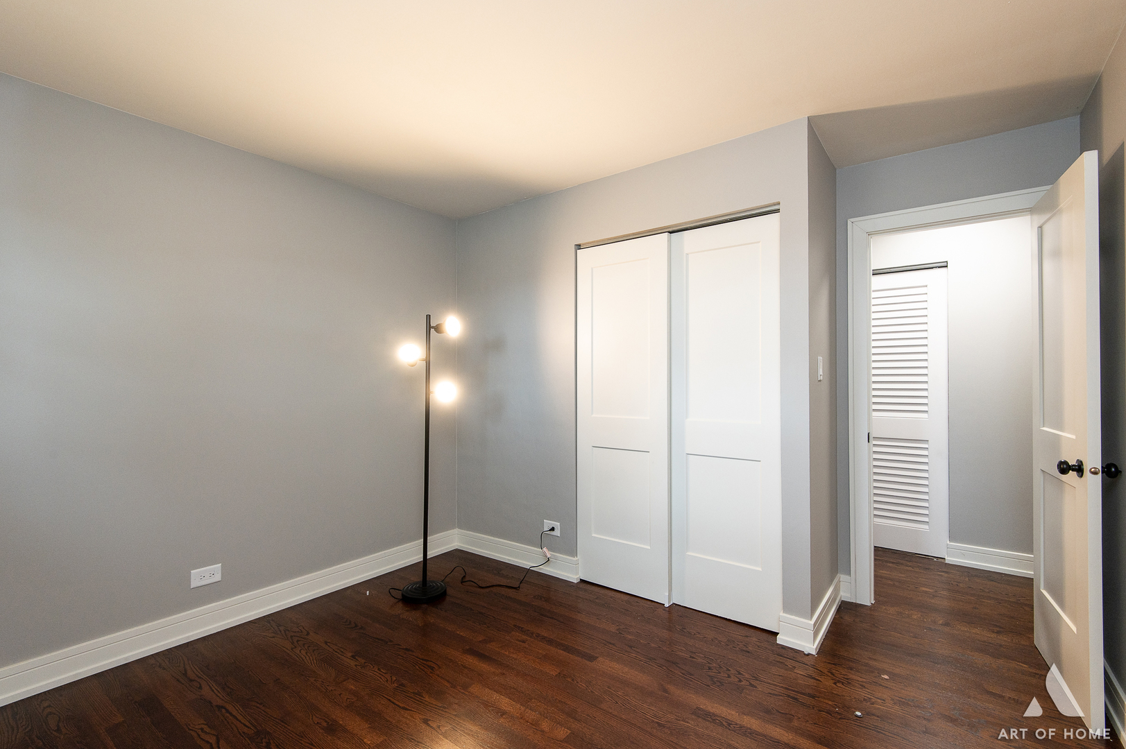 9128 Homestead Lane Bridgeview, IL 60455 - Photo 21 of 32 an empty room with wooden floor and windows