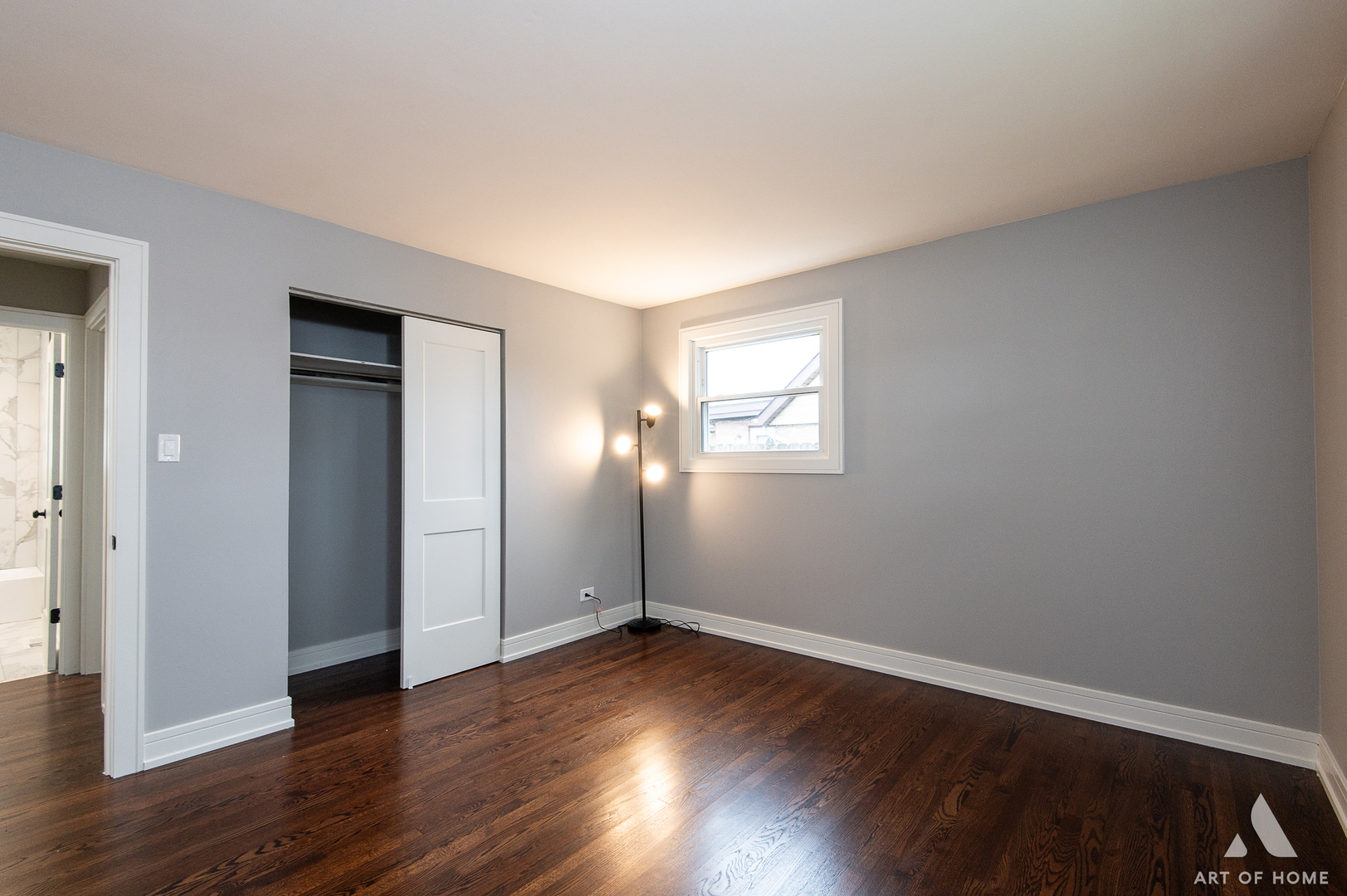 9128 Homestead Lane Bridgeview, IL 60455 - Photo 23 of 32 an empty room with wooden floor and windows