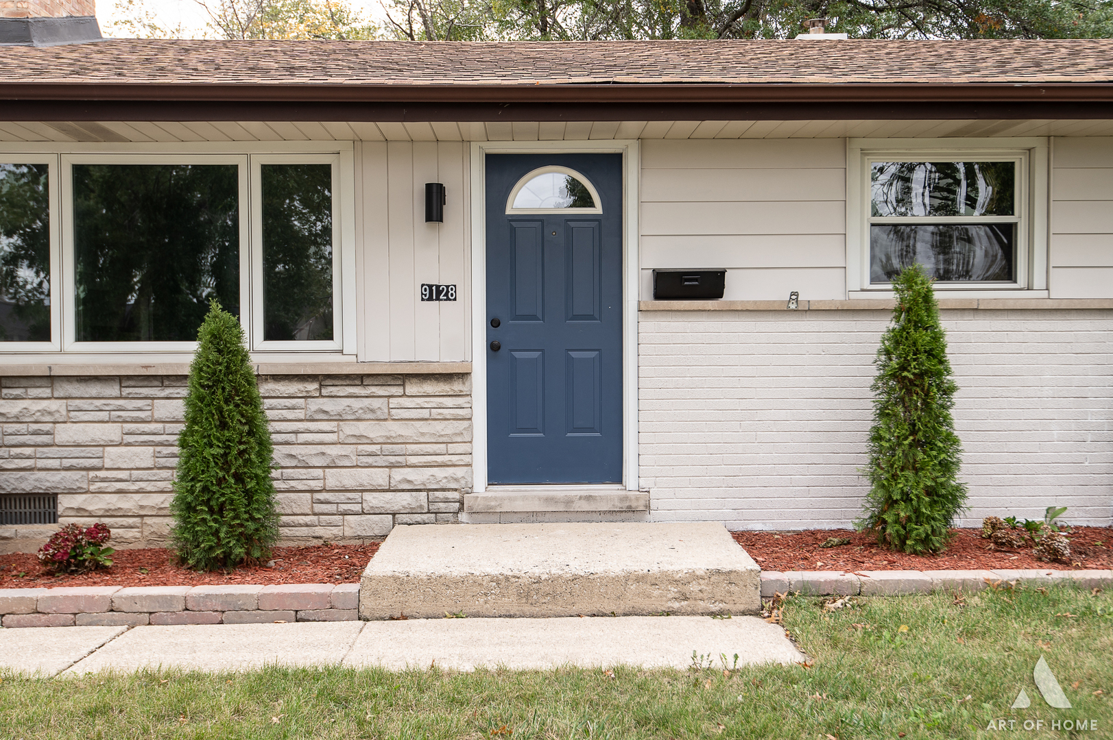 9128 Homestead Lane Bridgeview, IL 60455 - Photo 3 of 32 a front view of a house with a yard and garage
