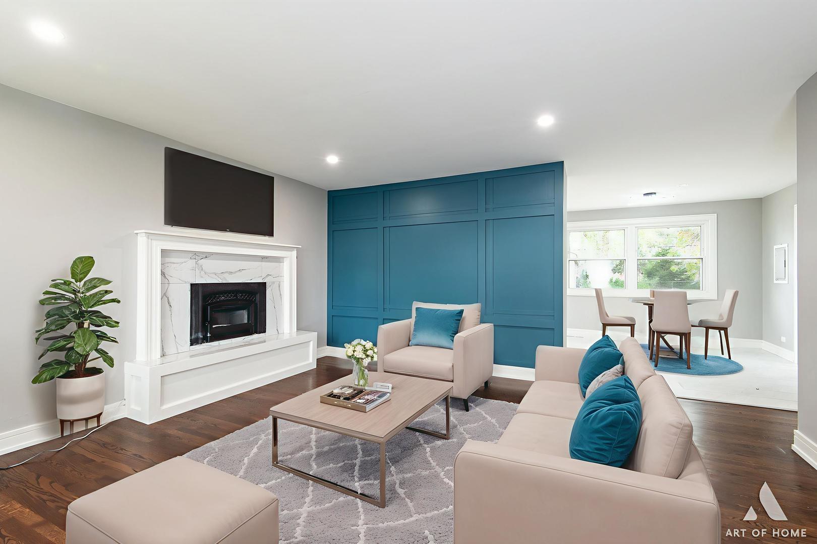 9128 Homestead Lane Bridgeview, IL 60455 - Photo 9 of 32 a living room with furniture a fireplace and a flat screen tv