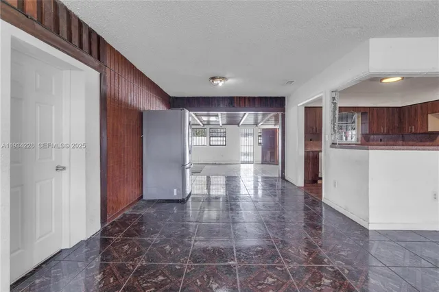 a view of a kitchen with a sink and cabinets