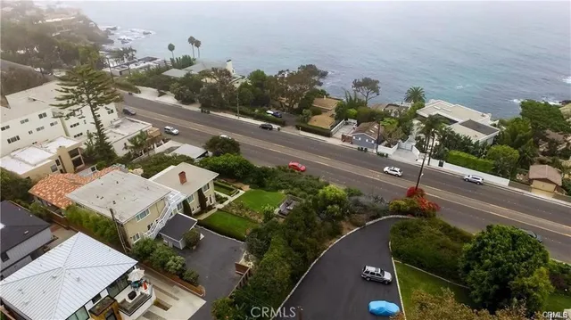 an aerial view of a house with a yard and garden