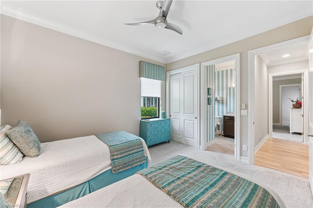 11974 Maidstone Court Naples, FL 34120 - Photo 24 of 45 Bedroom with light colored carpet, ornamental molding, and a ceiling fan