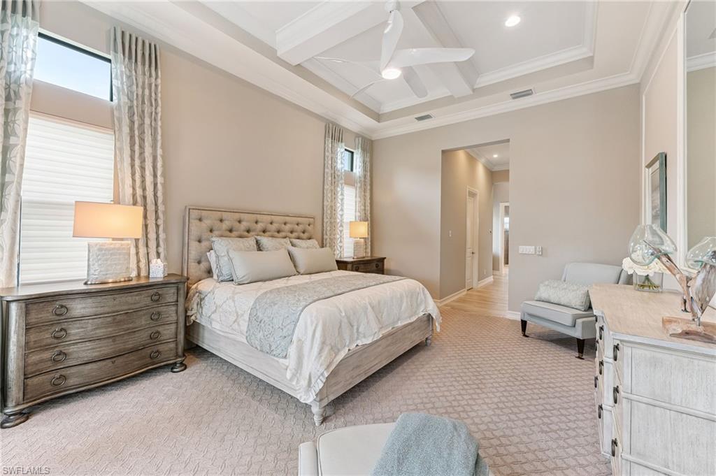 11974 Maidstone Court Naples, FL 34120 - Photo 34 of 45 Bedroom with ornamental molding, beamed ceiling, light carpet, coffered ceiling, and ceiling fan