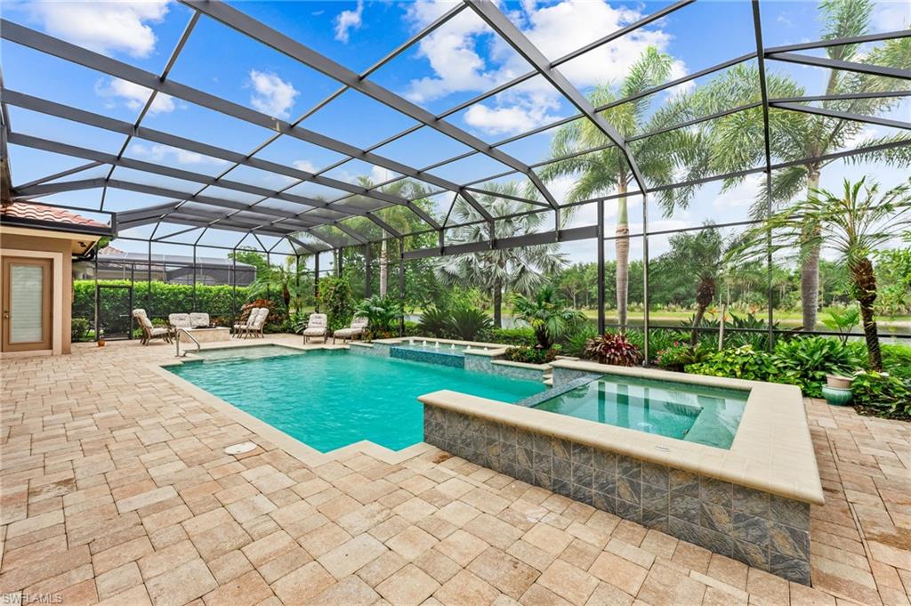 11974 Maidstone Court Naples, FL 34120 - Photo 7 of 45 View of pool featuring a patio area, a pool with connected hot tub, and a lanai and also a built in Fire Pit!